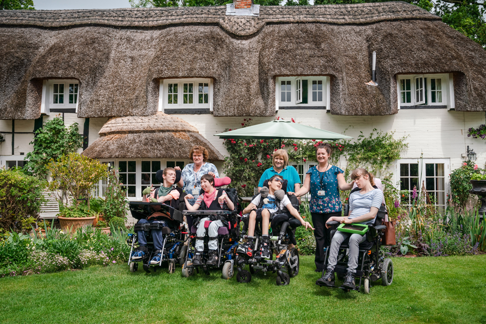 Students and staff from Treloars in the garden at The Thatched Cottage